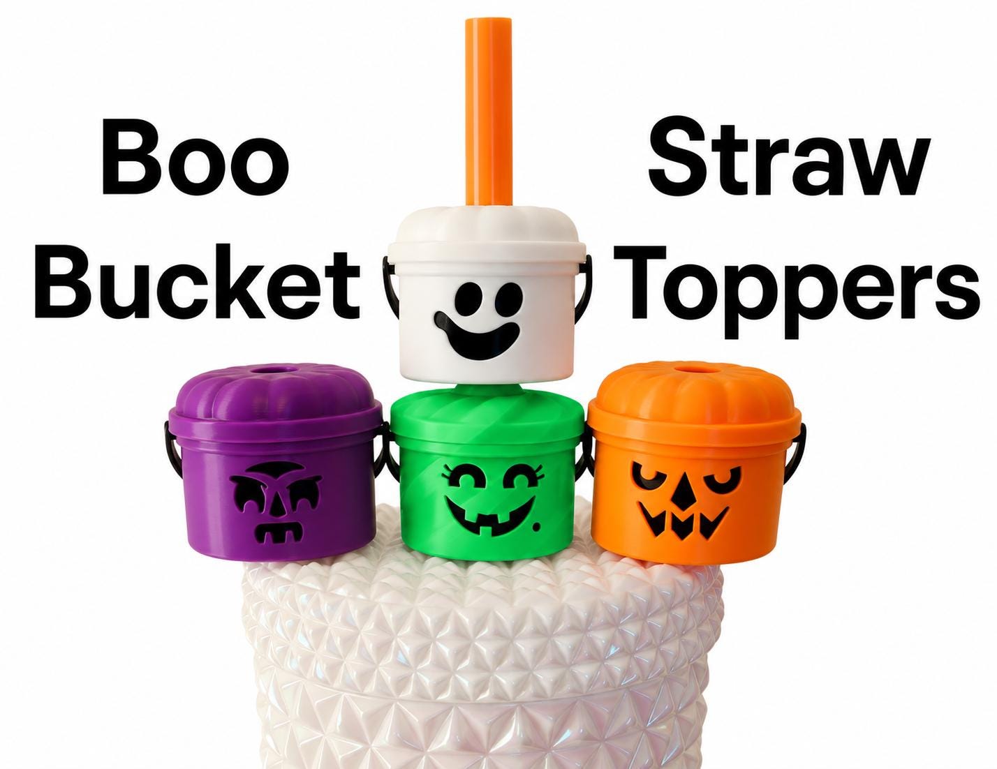 Four miniature plastic bucket straw toppers in purple, green, orange, and white, each featuring a unique black facial expression. The white topper has an orange straw inserted. The text Boo Bucket Straw Toppers is visible.